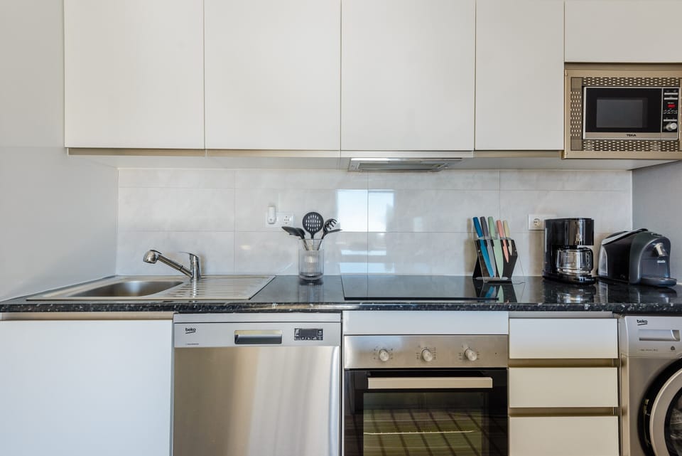 Apartment, 1 Bedroom, Pool Access, Sea View | Private kitchen | Microwave, oven, dishwasher, coffee/tea maker
