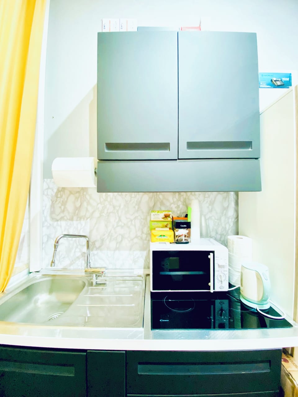 Mini-fridge, microwave, electric kettle, cookware/dishes/utensils