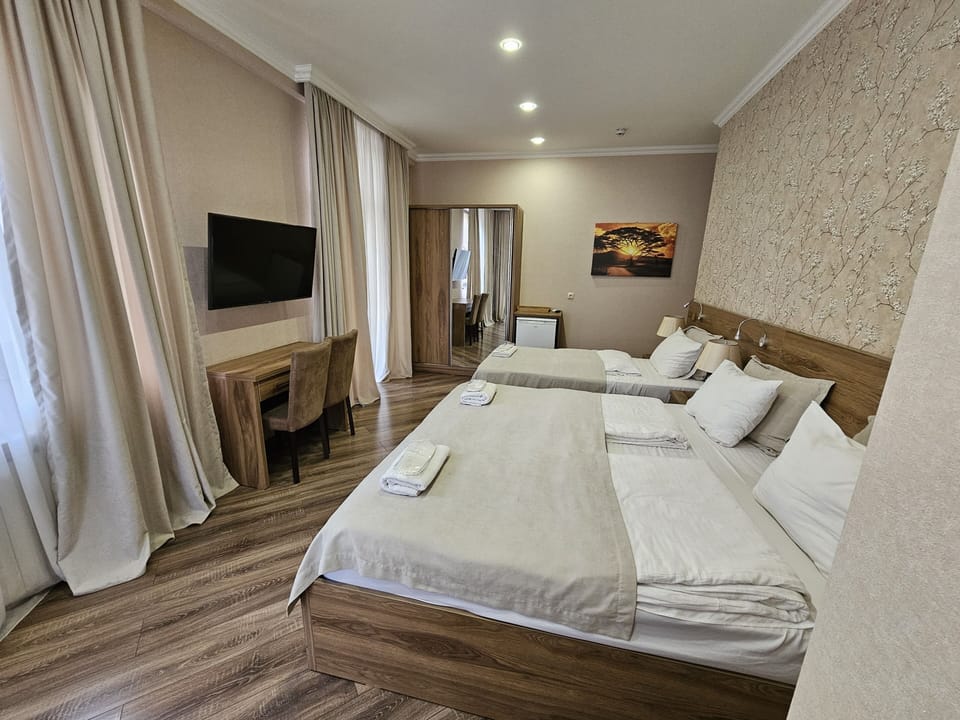 Deluxe Triple Room, City View | In-room safe, iron/ironing board, free WiFi
