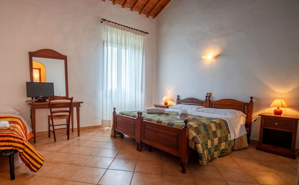 Family Triple Room, Pool View | Desk, laptop workspace, free WiFi