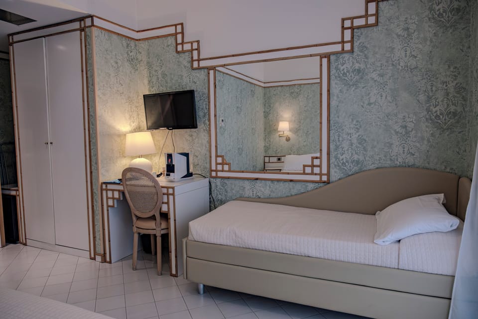 Classic Triple Room | Minibar, in-room safe, desk, laptop workspace