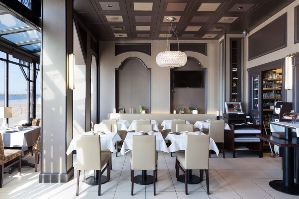Lunch, dinner served; French cuisine, beach views 