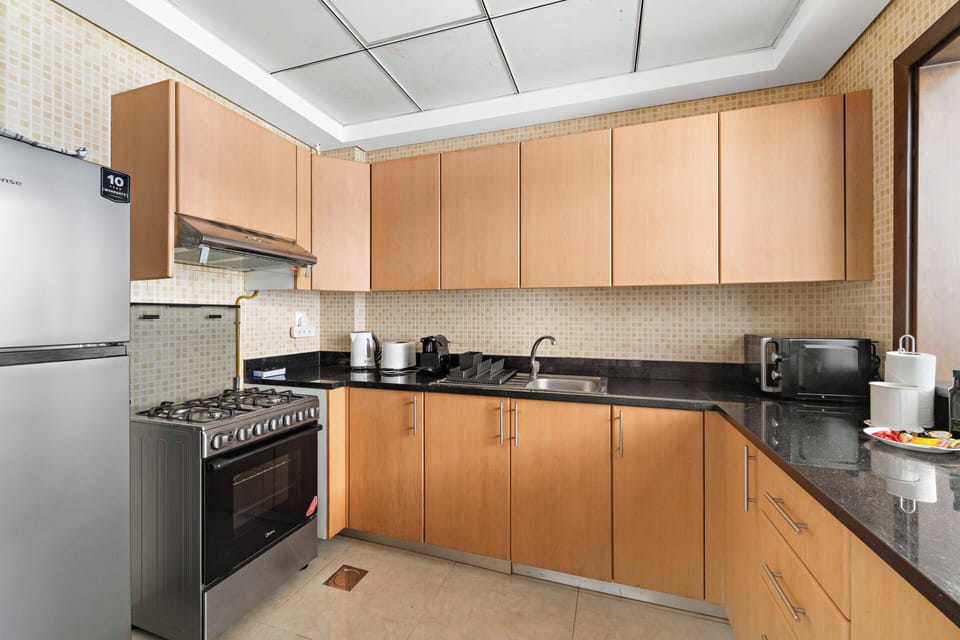 Signature Apartment, Multiple Beds | Private kitchen | Fridge, dishwasher, coffee/tea maker, electric kettle