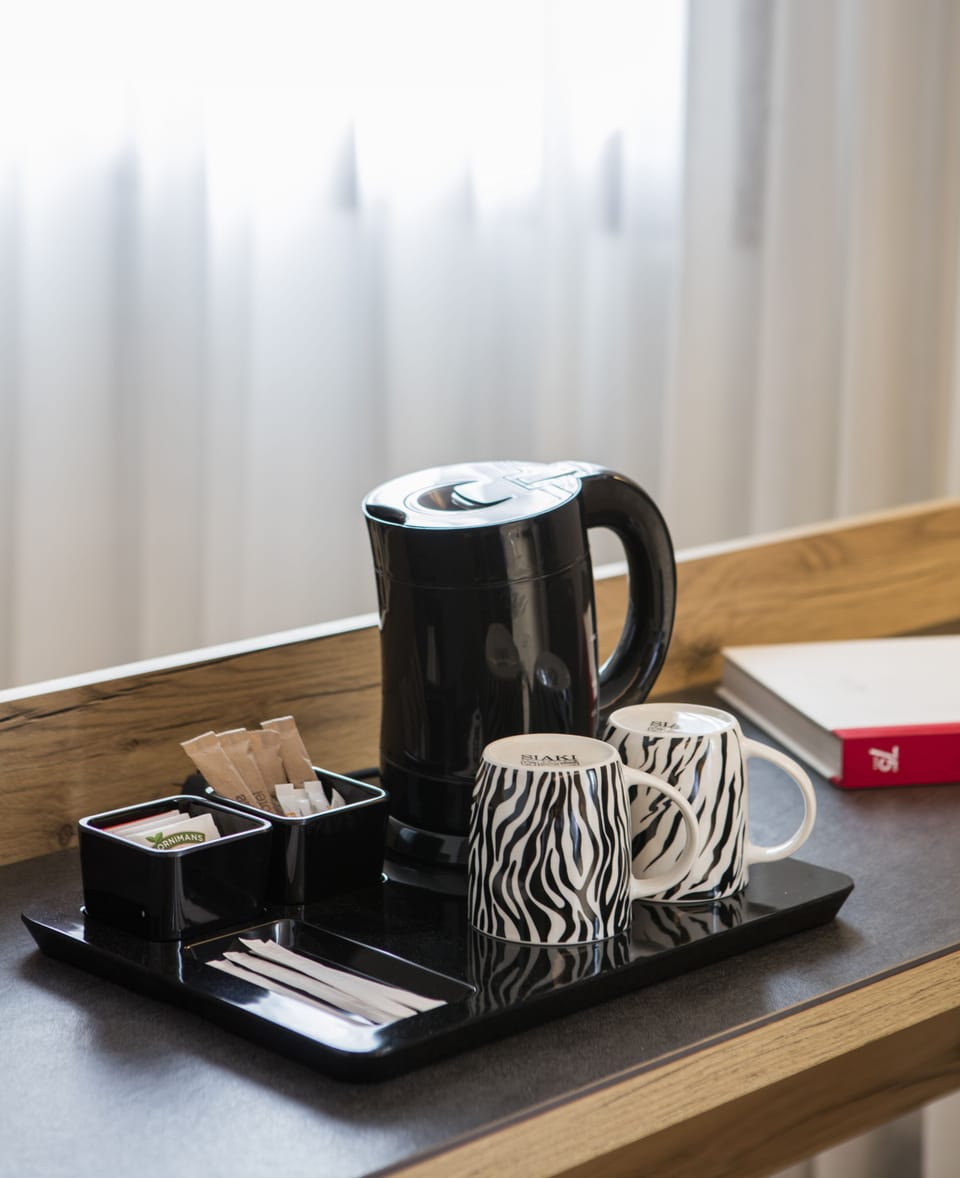 Premium bedding, down comforters, minibar, in-room safe