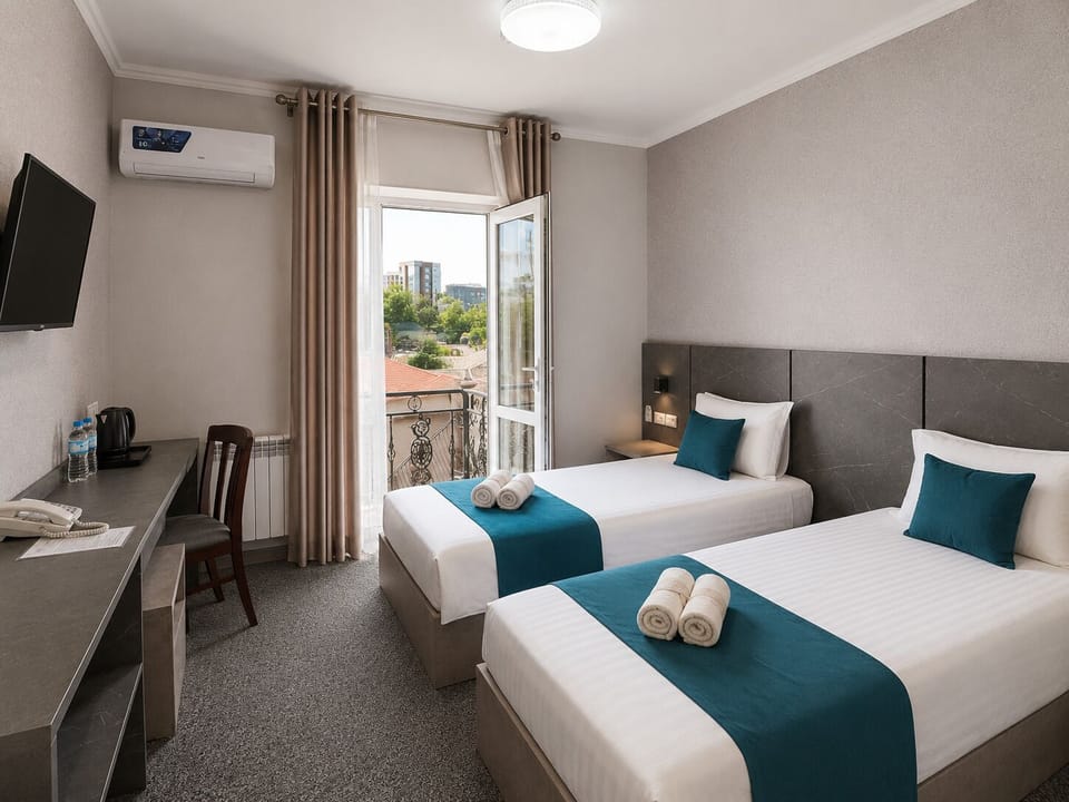 Standard Twin Room | Desk, laptop workspace, blackout drapes, iron/ironing board (on request)