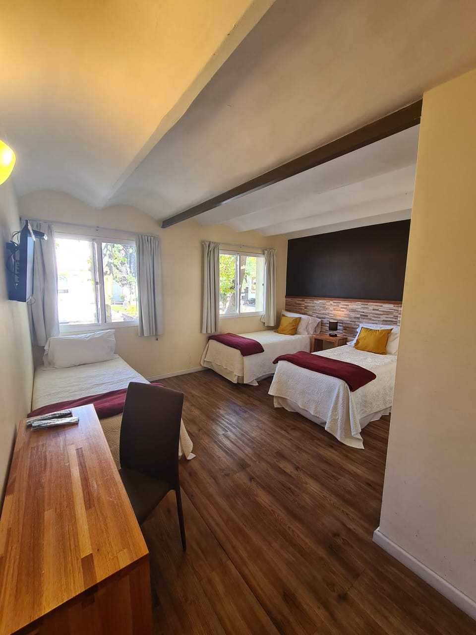 Superior Triple Room | Minibar, in-room safe, desk, blackout drapes
