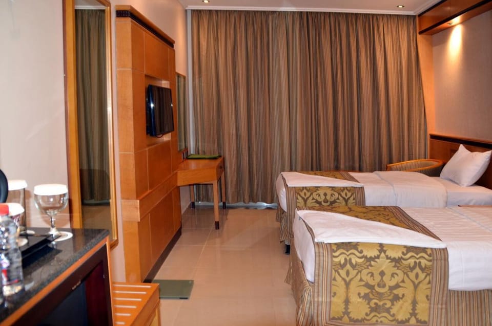 Basic Double Room, City View | In-room safe, iron/ironing board, free WiFi, bed sheets