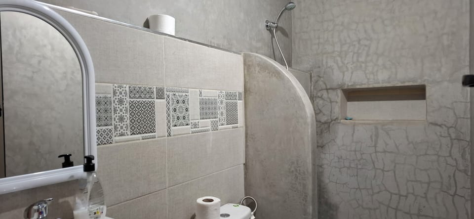 Deluxe Bungalow, Multiple Beds, Partial Ocean View | Bathroom | Shower, towels, toilet paper