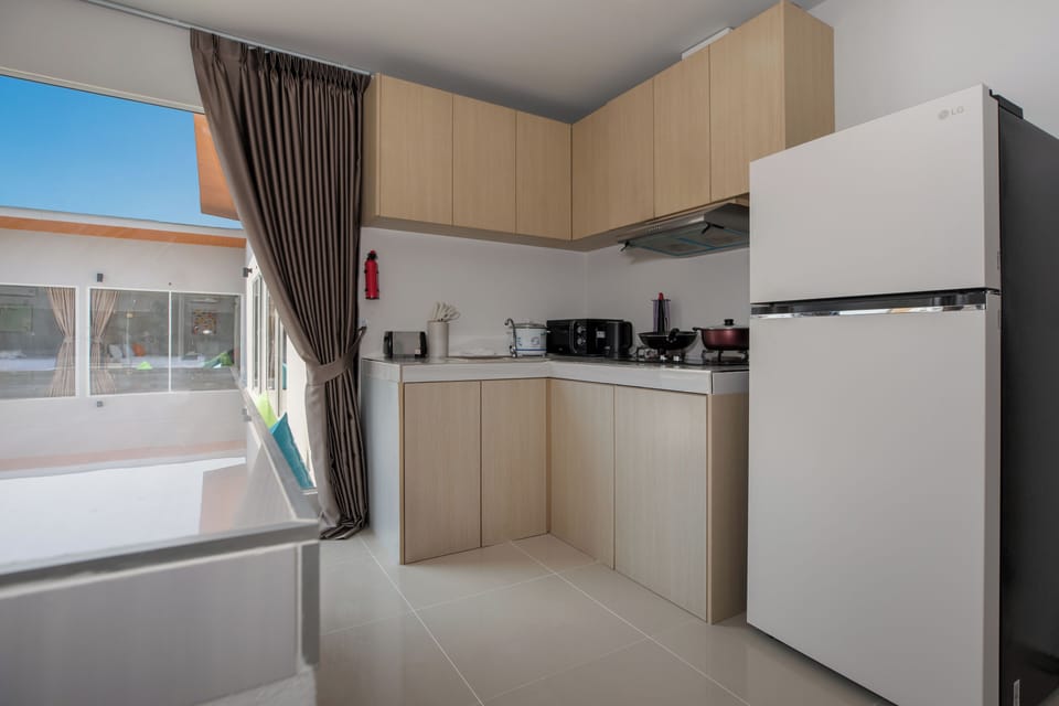 One bedroom suite with pool access | Private kitchen | Mini-fridge, coffee/tea maker, electric kettle
