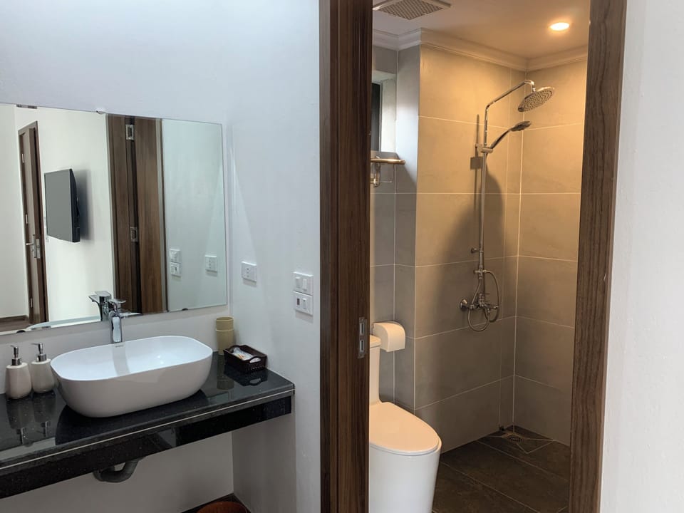 Comfort Room | Bathroom | Shower, hair dryer, slippers, towels