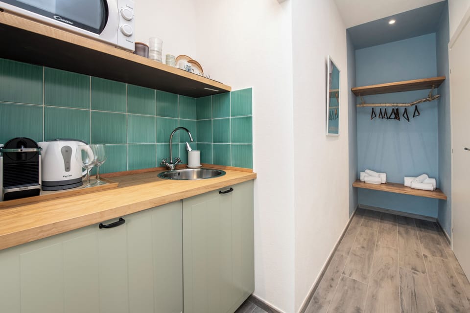 Superior Room, Kitchenette | Blackout drapes, iron/ironing board, free WiFi