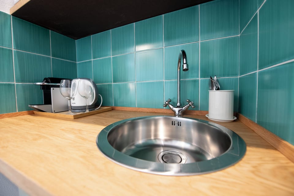 Superior Room, Kitchenette | Blackout drapes, iron/ironing board, free WiFi