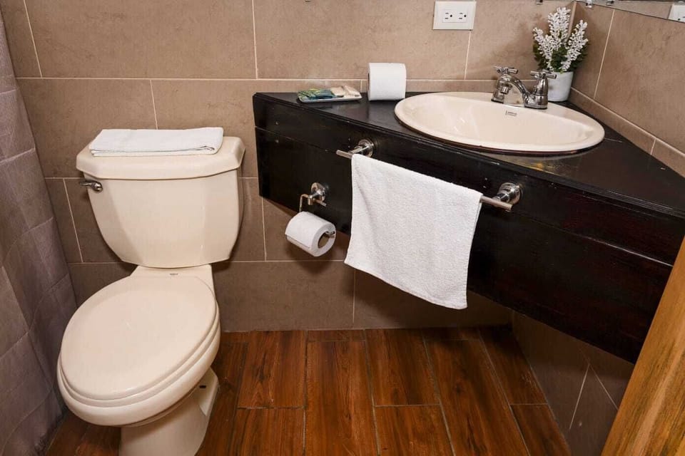 Family Quadruple Room, Garden View | Bathroom | Shower, towels, soap, shampoo