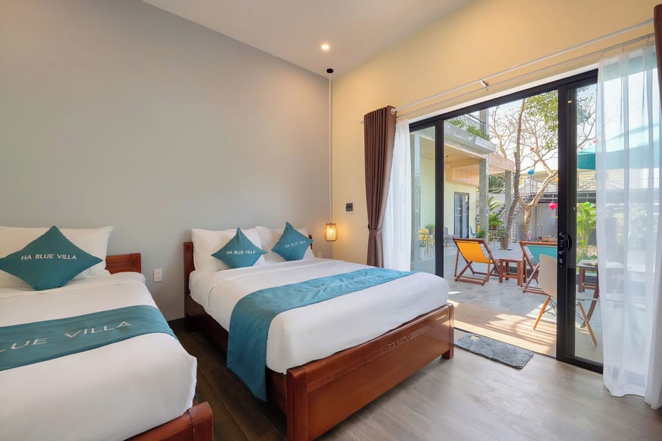 Deluxe Triple Room, Pool View | Desk, laptop workspace, soundproofing, free WiFi
