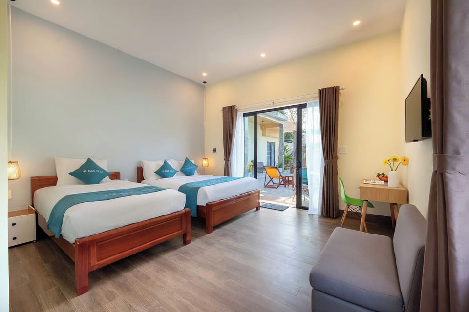 Deluxe Triple Room, Pool View | Desk, laptop workspace, soundproofing, free WiFi