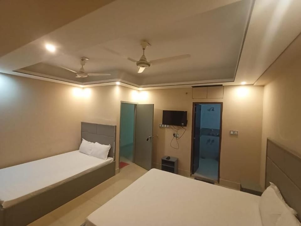 Deluxe Triple Room, City View | In-room safe, desk, laptop workspace, free WiFi