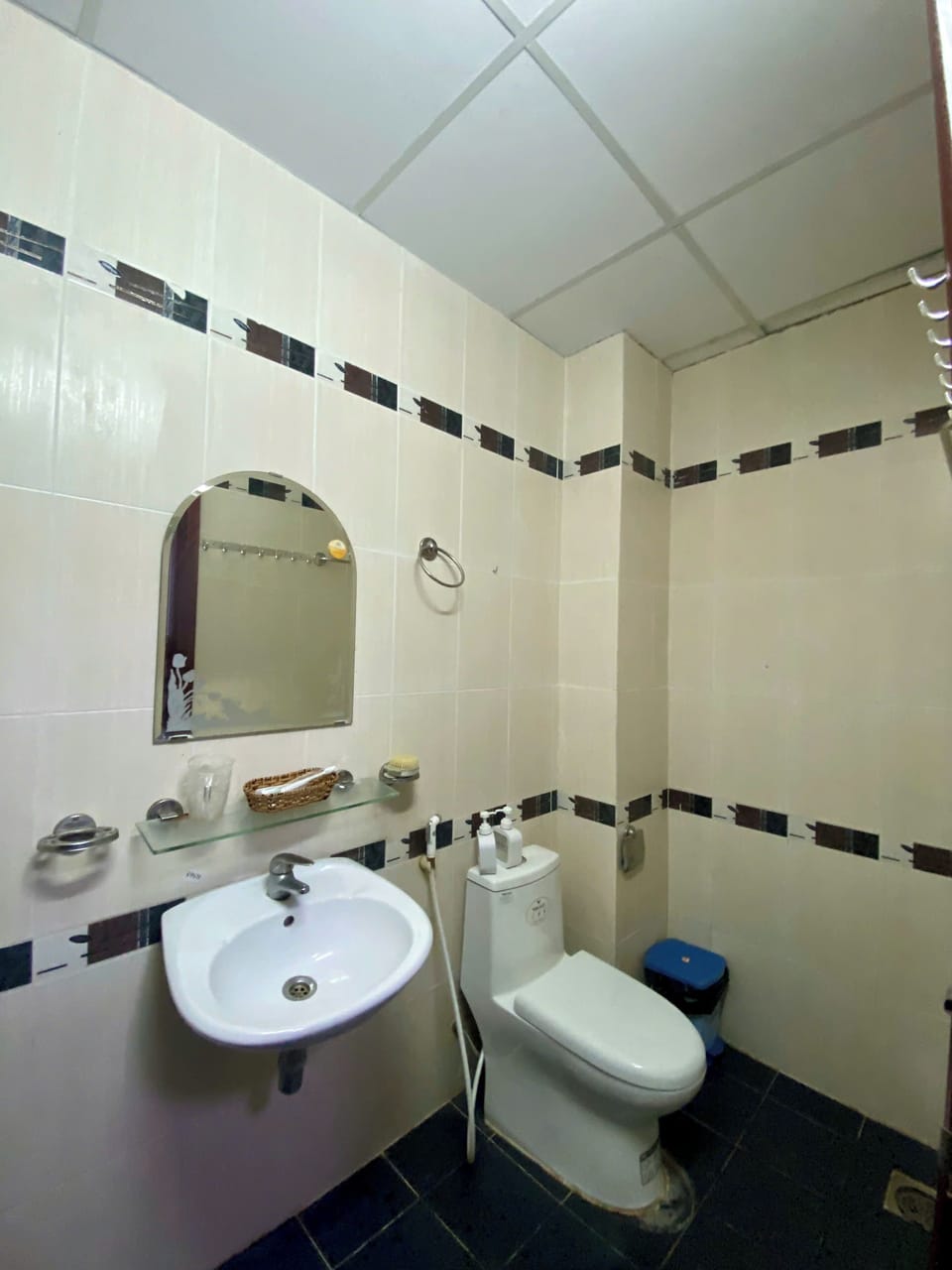 Shower, hair dryer, slippers, towels