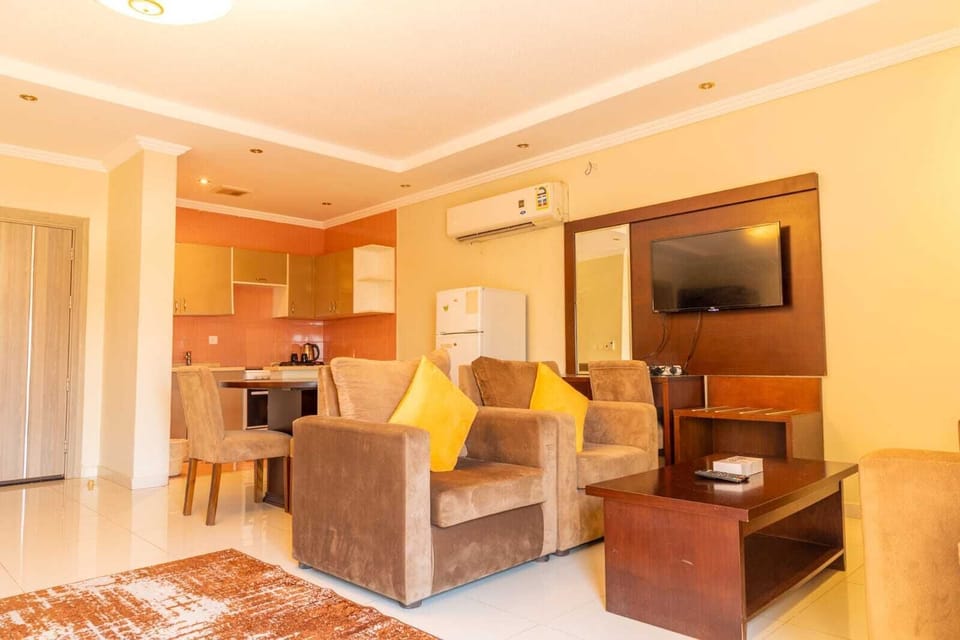 Suite, Kitchenette, Partial Sea View | Living area | TV