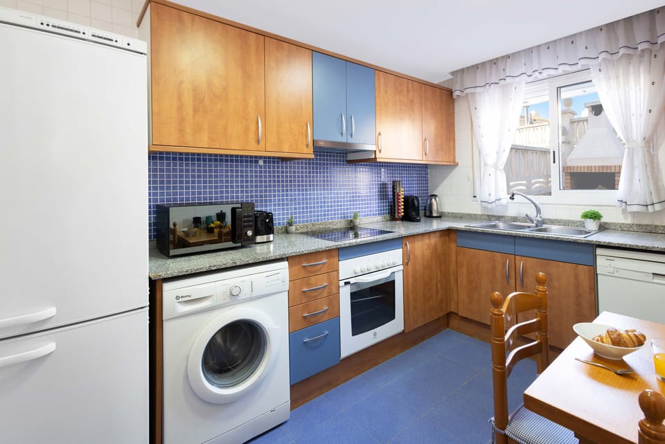 Microwave, dishwasher, coffee/tea maker, cookware/dishes/utensils