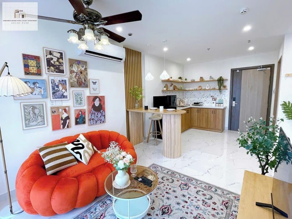Grand Apartment, 1 Bedroom, Balcony, City View | Living area | 24-inch Smart TV with cable channels