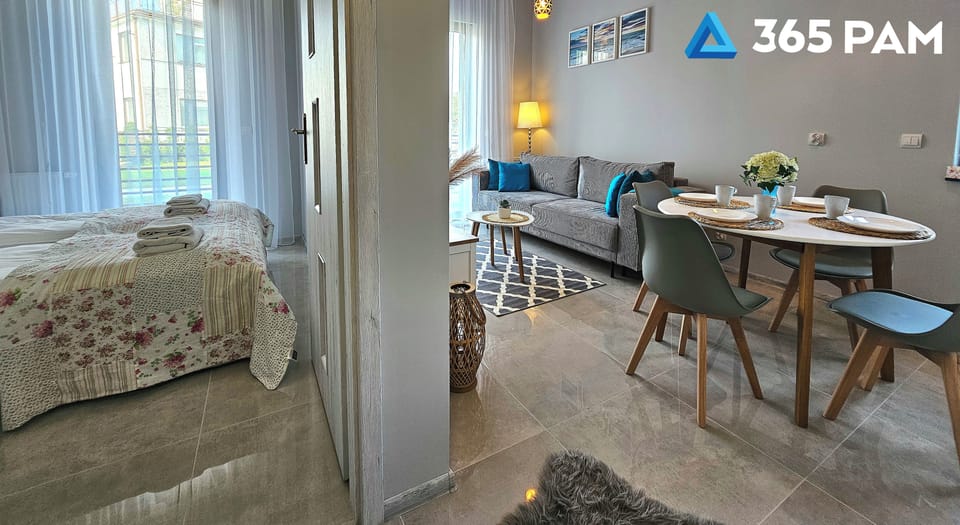 Comfort Apartment | Living area | 50-inch LCD TV with cable channels