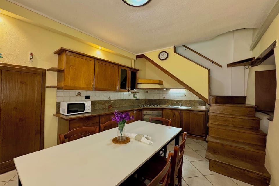 Family Townhome, Multiple Bedrooms (Borgo di Porlezza) | Private kitchen | Fridge, microwave, stovetop, coffee/tea maker