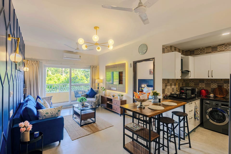 Deluxe Apartment, 1 Queen Bed, Balcony, Pool View | Living area | Flat-screen TV