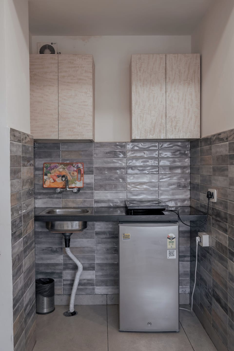 Mini-fridge, stovetop, cookware/dishes/utensils