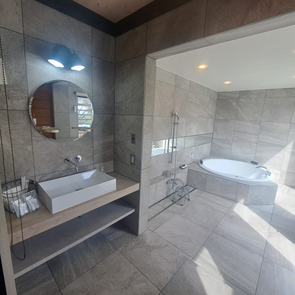 Luxury Cottage | Bathroom | Hair dryer, slippers, towels, soap