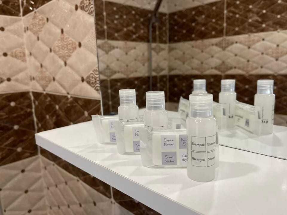 Separate tub and shower, towels, soap, shampoo