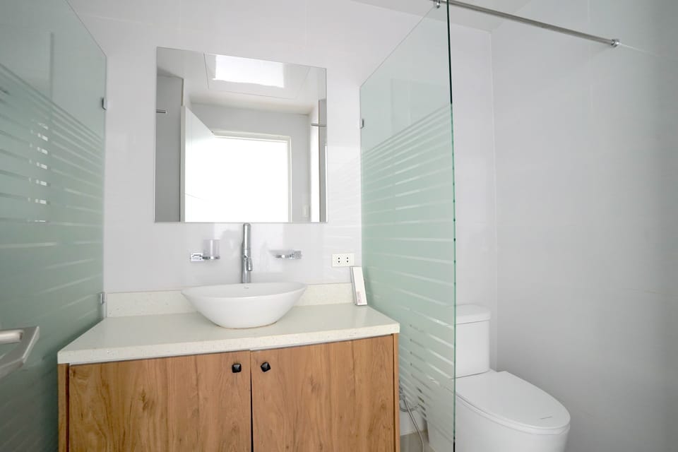 Shower, slippers, bidet, towels
