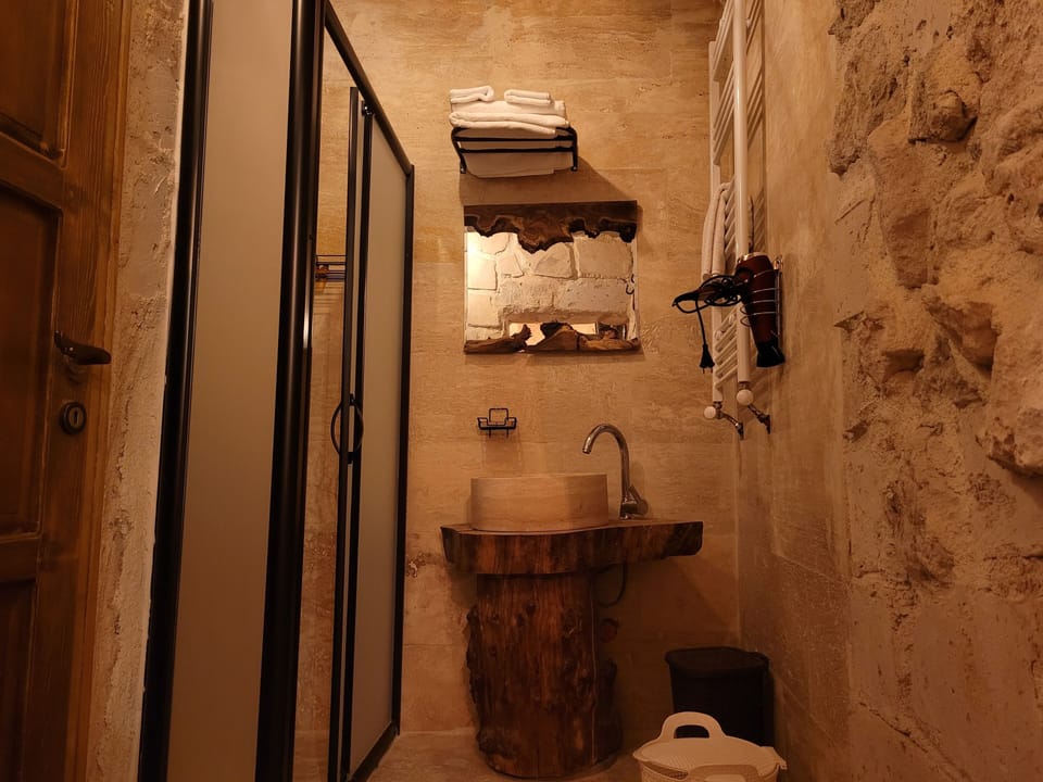 STONE ROOM 104 | Bathroom | Free toiletries, hair dryer, bathrobes, slippers