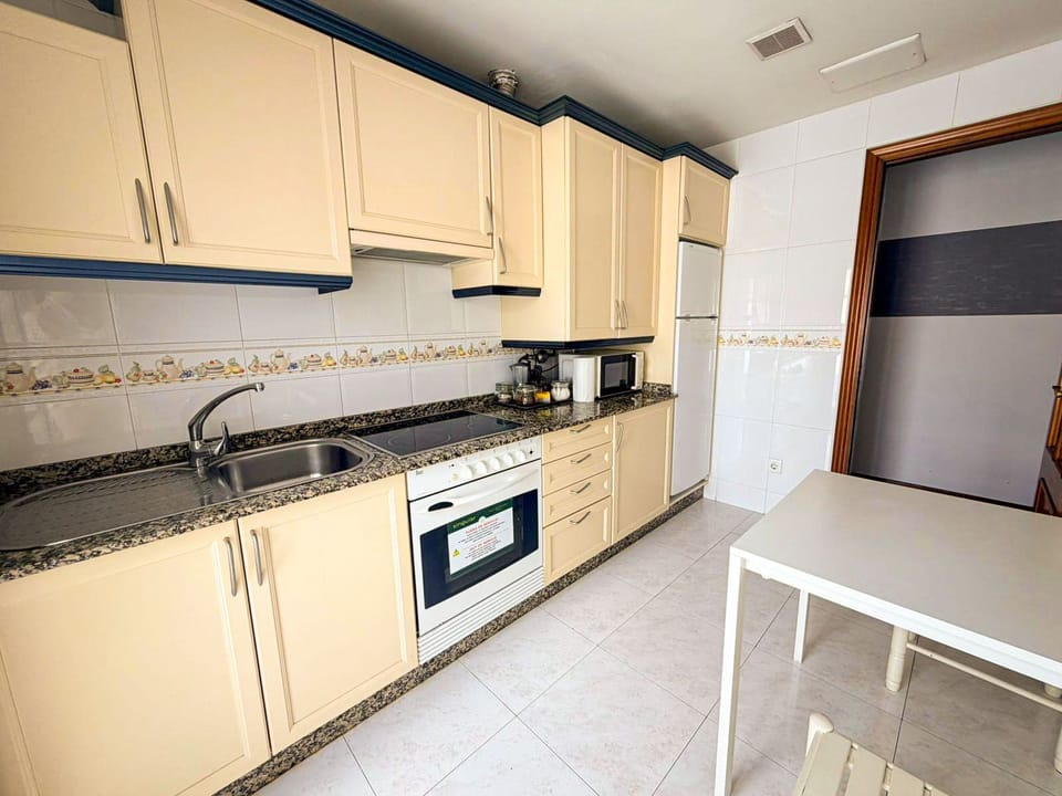 Fridge, microwave, stovetop, cookware/dishes/utensils