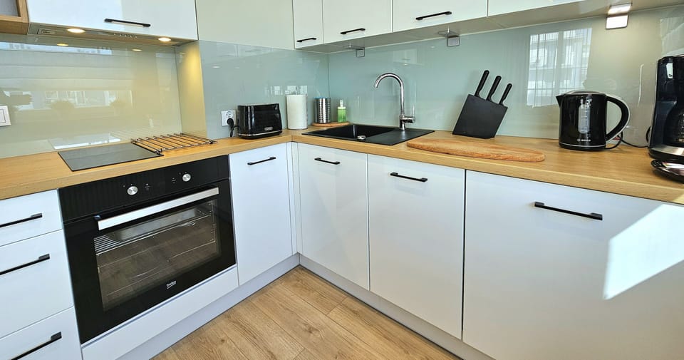 Comfort Apartment, Balcony | Private kitchen | Fridge, oven, stovetop, dishwasher