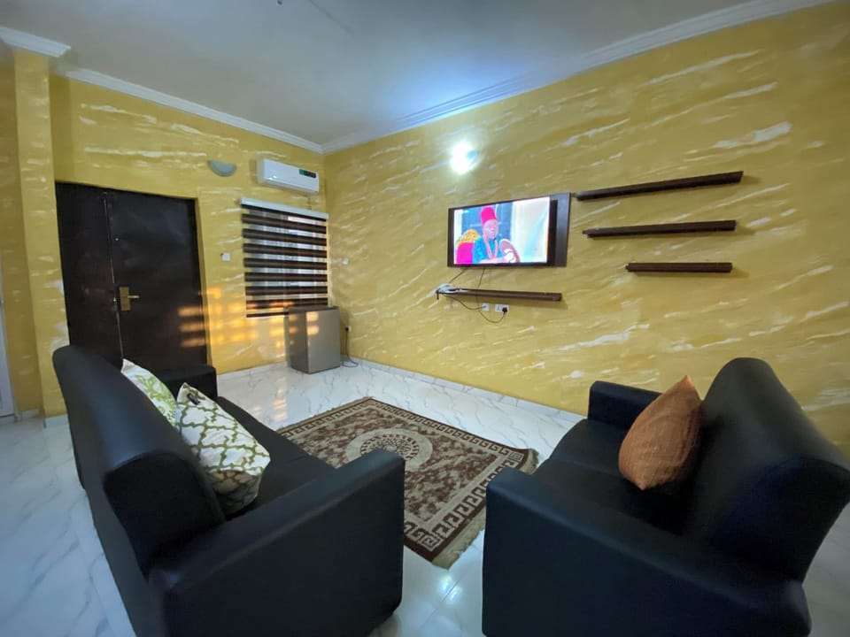 Family Apartment, Balcony, City View | Living area | Flat-screen TV