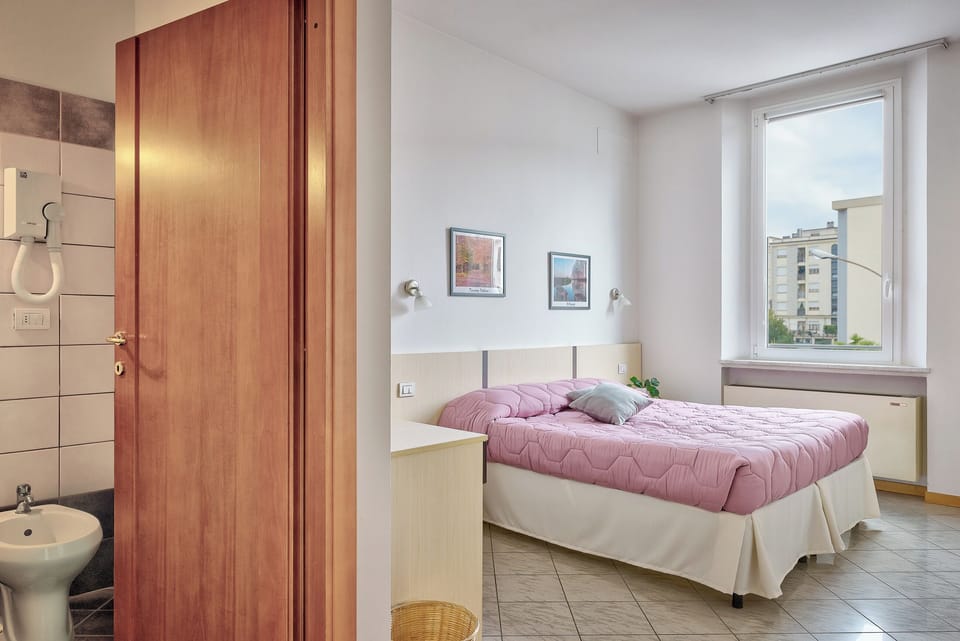 Double or Twin Room | Desk, laptop workspace, blackout drapes, free WiFi