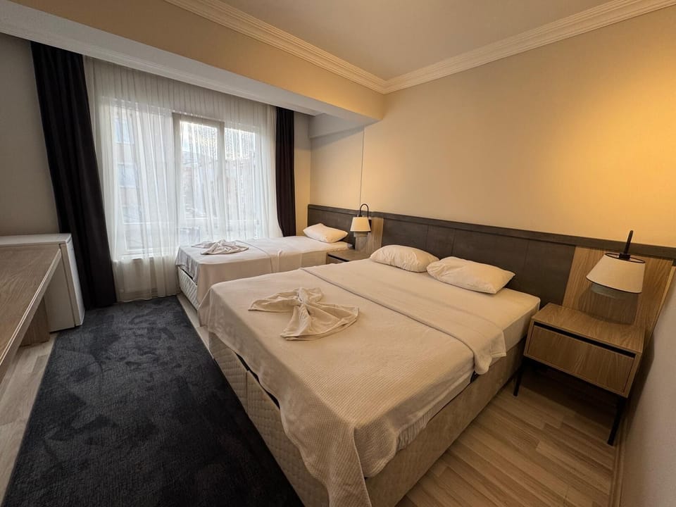 Triple Room, Balcony, City View | Laptop workspace, free WiFi