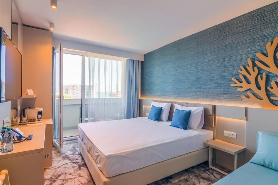 Deluxe Triple Room, Balcony | In-room safe, blackout drapes, free WiFi, bed sheets