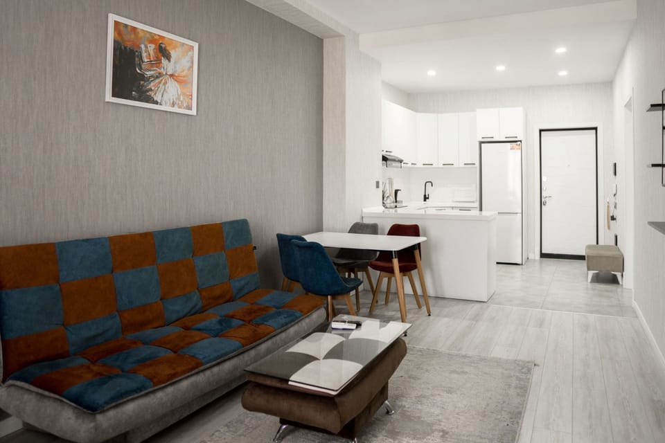 Comfort Apartment, Balcony, City View | Living area | 33-inch LED TV with satellite channels