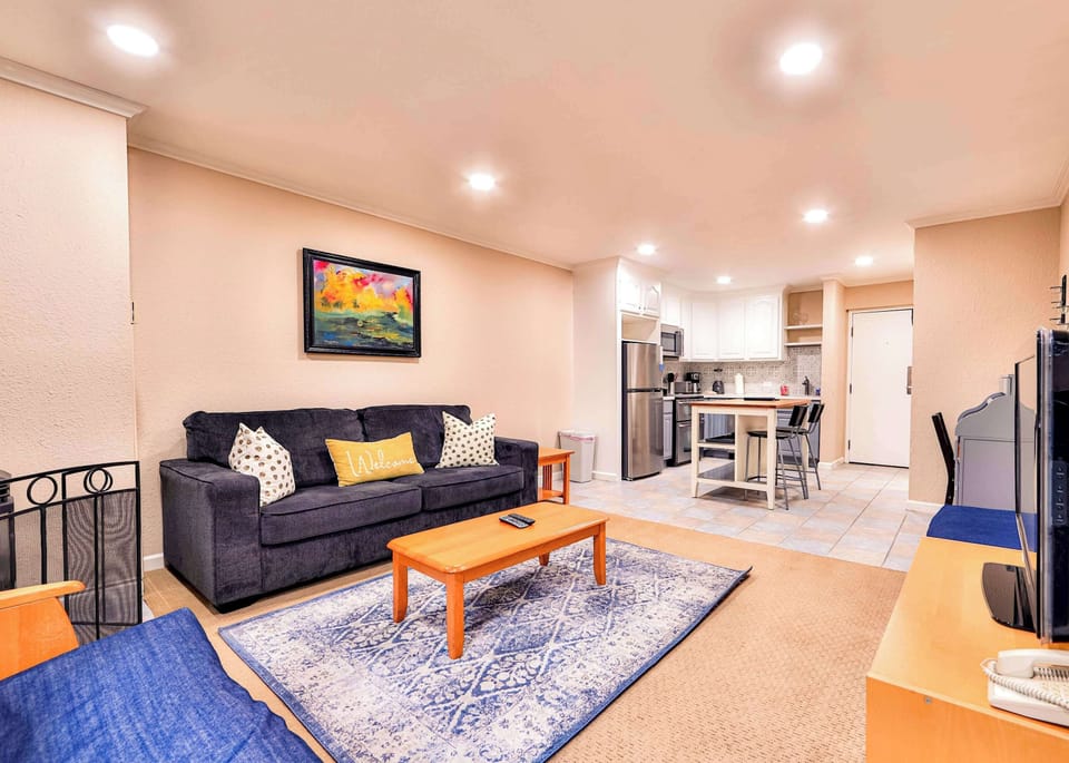 Apartment, 1 King Bed with Sofa bed, Balcony, Mountain View (Lakeland Getaway) | Living area | 42-inch flat-screen TV with digital channels, fireplace