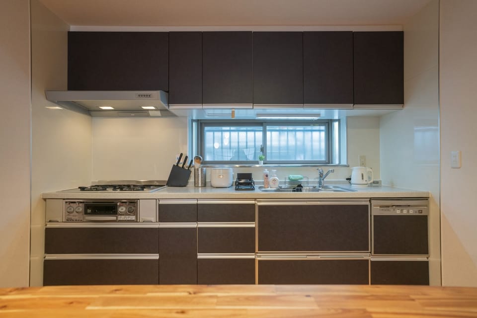 Comfort Villa | Private kitchen | Rice cooker, cleaning supplies, paper towels, dining tables