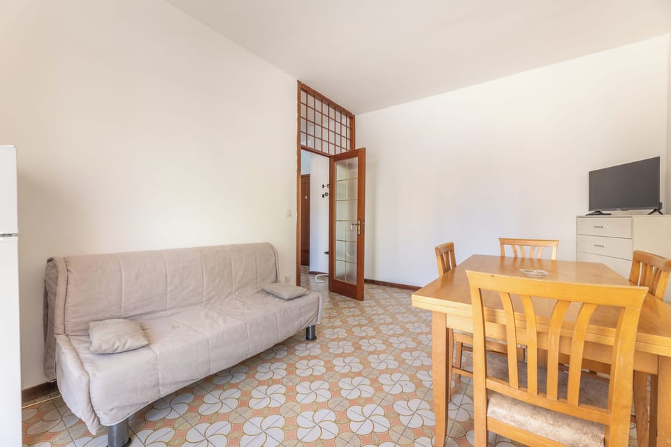 Apartment, Balcony, City View | Living area | 32-inch flat-screen TV with cable channels