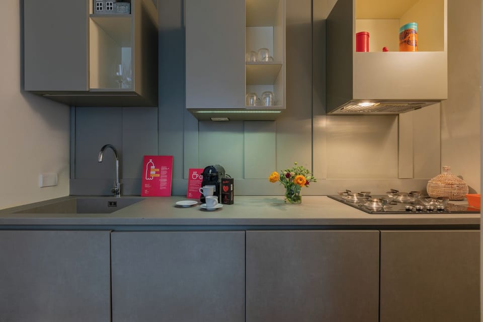 Deluxe Apartment | Private kitchen | Espresso maker, coffee/tea maker, toaster, cookware/dishes/utensils