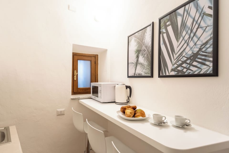 Apartment (1 Bedroom) | Private kitchen | Espresso maker, microwave, electric kettle, highchair