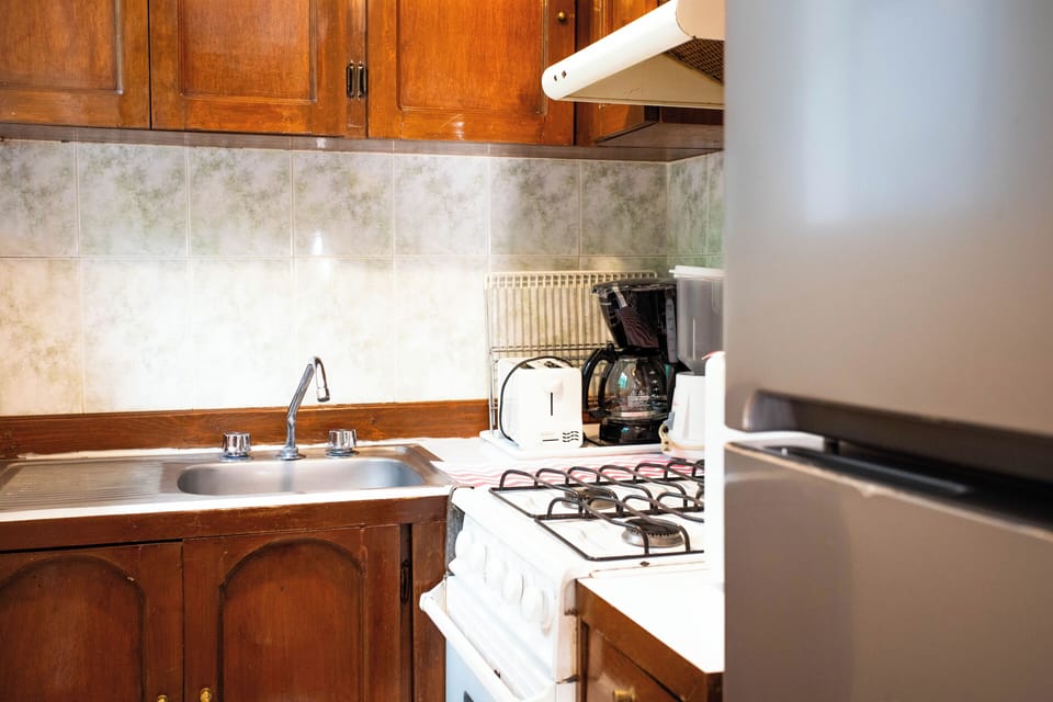 Standard Apartment, Courtyard View | Private kitchen | Full-size fridge, microwave, oven, stovetop