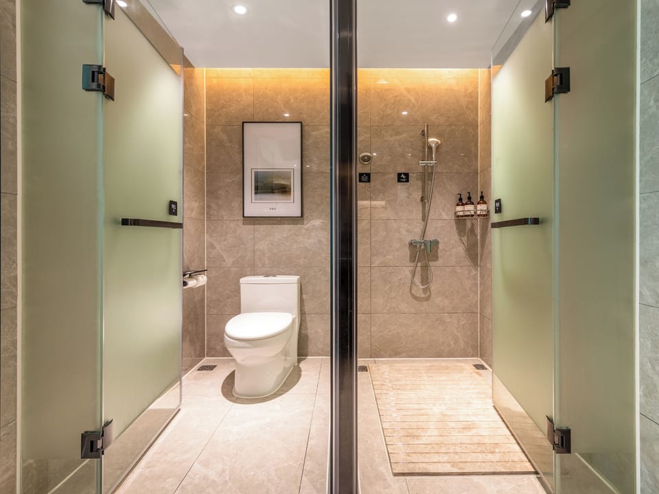 Shower, hair dryer, slippers, towels