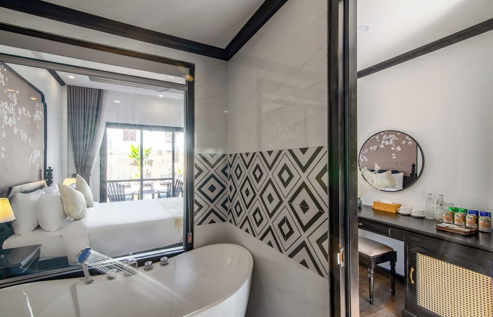 Double pool view with bathtub | Bathroom | Shower, free toiletries, hair dryer, slippers