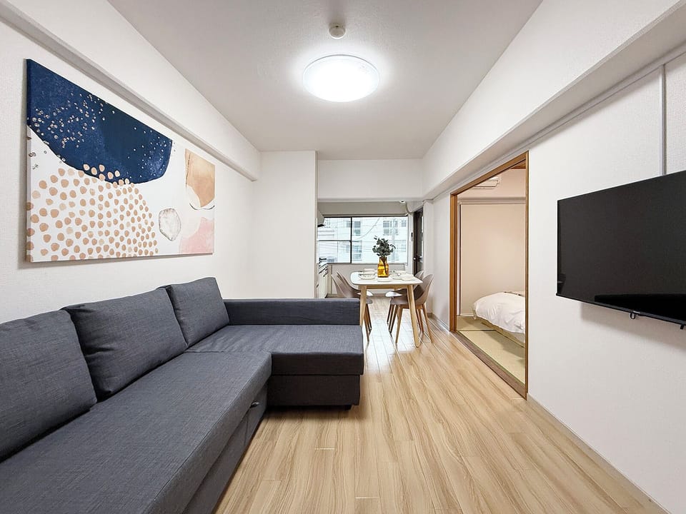 Family Apartment, Non Smoking | Living area | 50-inch Smart TV with cable channels