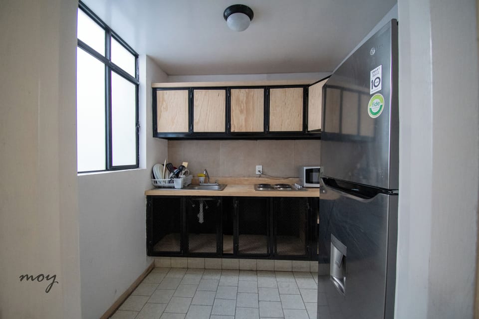Comfort Apartment | Private kitchen | Full-size fridge, microwave, cookware/dishes/utensils