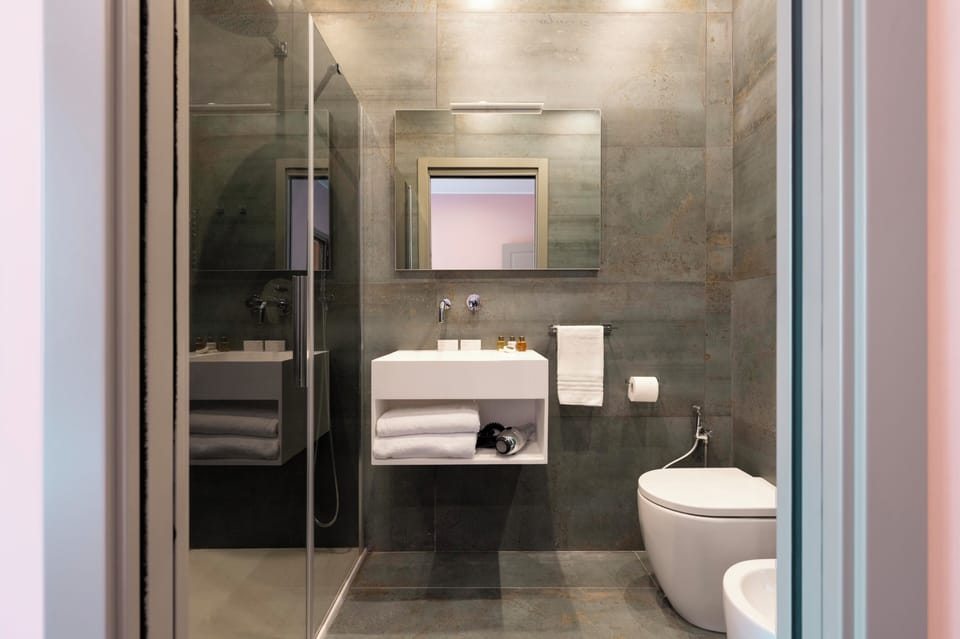 Standard Double Room, City View | Bathroom | Shower, designer toiletries, hair dryer, slippers